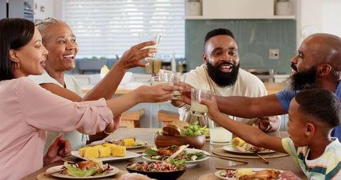 Joyous Family Bonding Over Meal at Home Kitchen