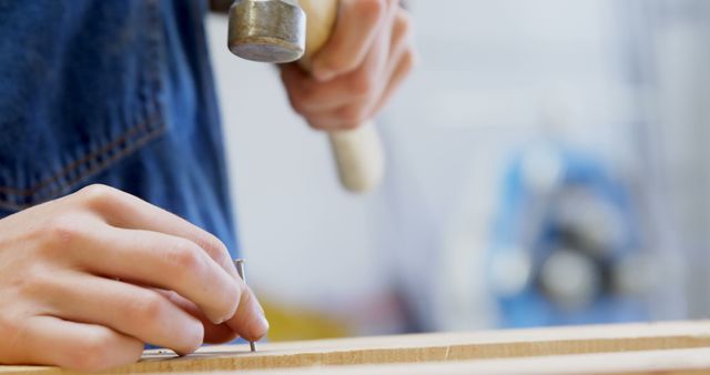 Carpenter Hammering Nail in Workshop - Download Free Stock Images Pikwizard.com