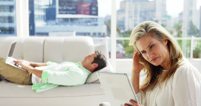 Couple Relaxing with Digital Devices in Modern Living Room - Download Free Stock Images Pikwizard.com