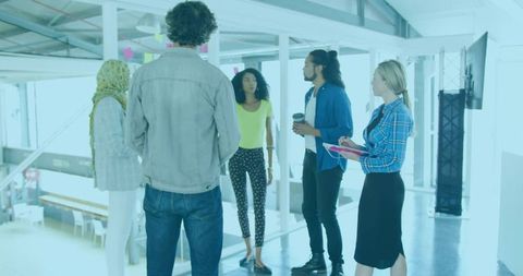 Diverse Team Brainstorming in Contemporary Office Setting