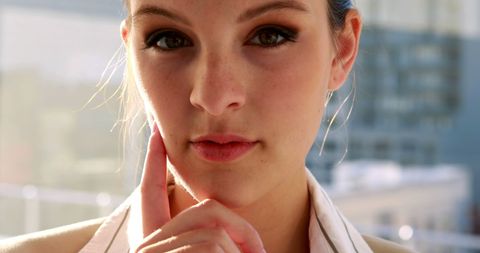 Confident Businesswoman Contemplating in Bright Office Setting