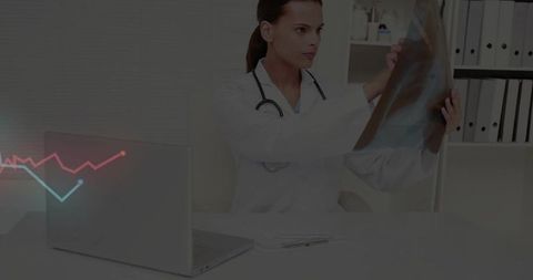 Doctor Analyzing X-ray Images with Technology