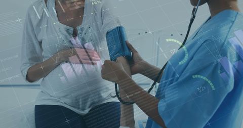Pregnant Woman Receiving Blood Pressure Check with Digital Data Overlay