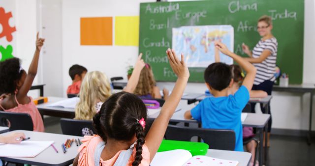 Diverse Students Raising Hands in Classroom with Teacher - Download Free Stock Images Pikwizard.com