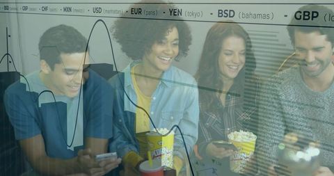 Friends with popcorn engaging with technology amid financial insights