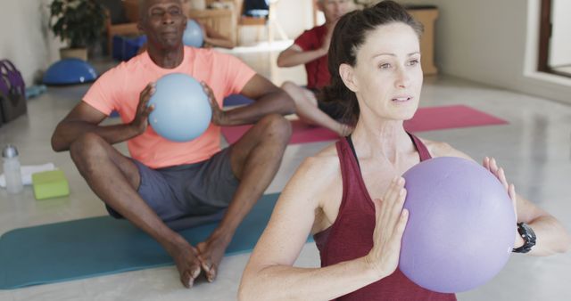 Seniors Participating in Yoga Fitness Class with Exercise Balls - Download Free Stock Images Pikwizard.com