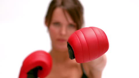 Female Boxer Punching in Dynamic Motion with Focus
