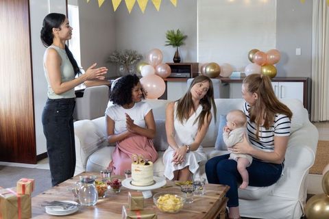 Celebrating First Birthday at Home with Friends and Cake