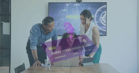 Multicultural team collaborating on fintech product presentation using laptop and tablet