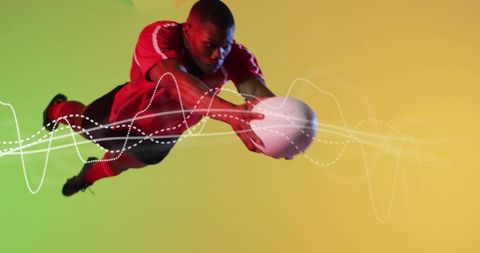 Diving goalkeeper reaching to catch ball midair with vibrant gradient and motion overlays