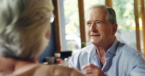 Senior Couple Enjoying a Comfortable Conversation at Home - Download Free Stock Images Pikwizard.com