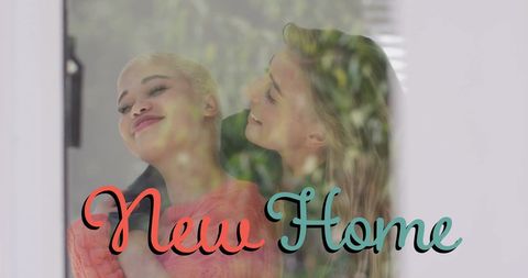 Happy Couple Embraces in New Home Celebration