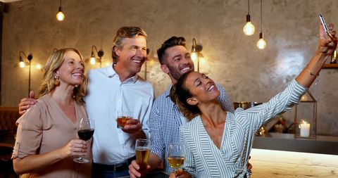 Diverse Friends Celebrating with Drinks and Selfie - Download Free Stock Images Pikwizard.com