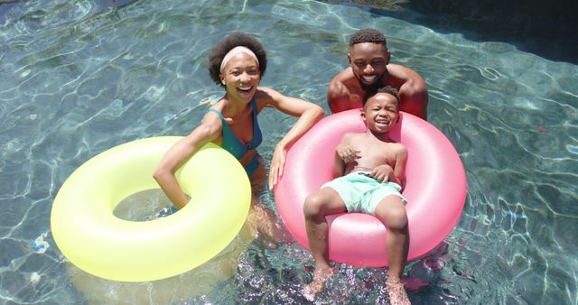 Happy Family Enjoying Summer Day in Swimming Pool - Download Free Stock Images Pikwizard.com