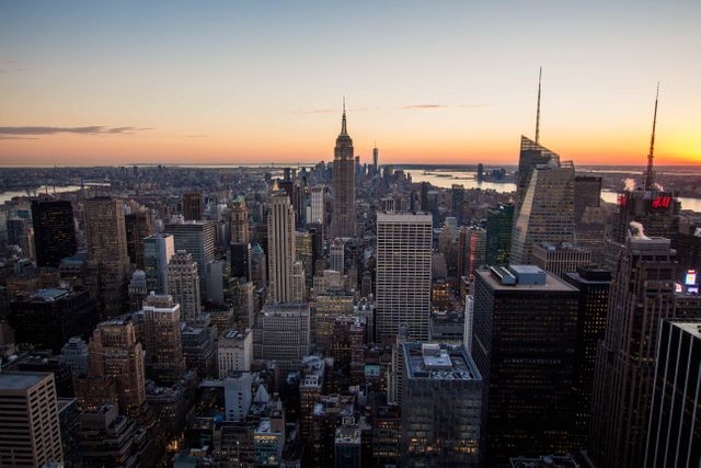 New York City skyline at sunset showcasing iconic skyscrapers of Manhattan - Download Free Stock Photos Pikwizard.com