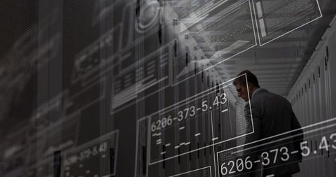 Engineer inspecting data center with holographic analytics overlay and server racks