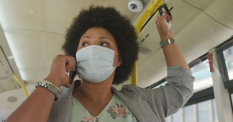 Woman Wearing Face Mask Talking on Phone on Public Bus - Download Free Stock Images Pikwizard.com