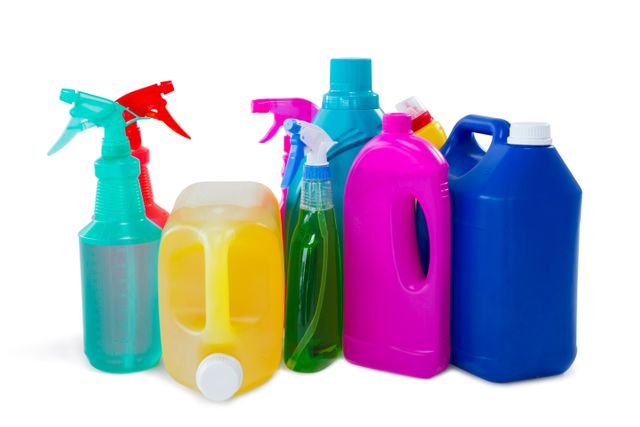 Various cleaning products in colorful plastic bottles, including spray bottles and detergent containers. Ideal for illustrating household cleaning, sanitation, and hygiene topics. Useful for advertisements, articles, and blogs related to cleaning supplies and home maintenance.