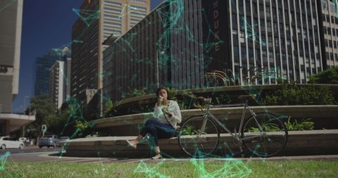 Woman Relaxing with Smartphone in Futuristic Urban Setting - Download Free Stock Images Pikwizard.com