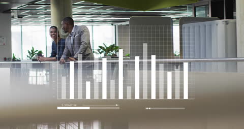 Diverse Business Professionals Discussing Financial Data in Modern Office