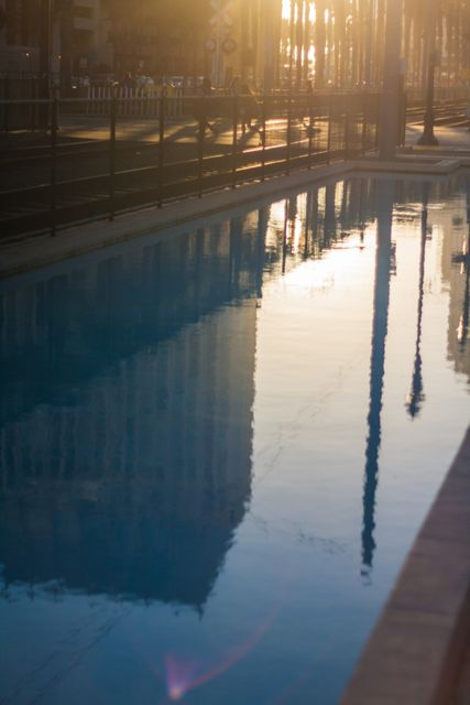 Cityscape Reflected in Pool with Golden Sunset - Download Free Stock Images Pikwizard.com