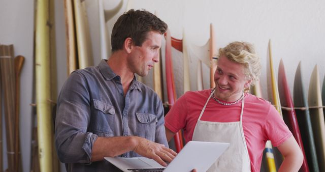 Surfboard Shop Owner and Clerk Discussing Business Strategy - Download Free Stock Images Pikwizard.com