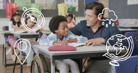 Kneeling teacher helping student in wheelchair reading workbook in inclusive classroom