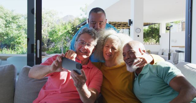 Happy senior diverse people taking selfie at retirement home. healthy, active retirement and body inclusivity.