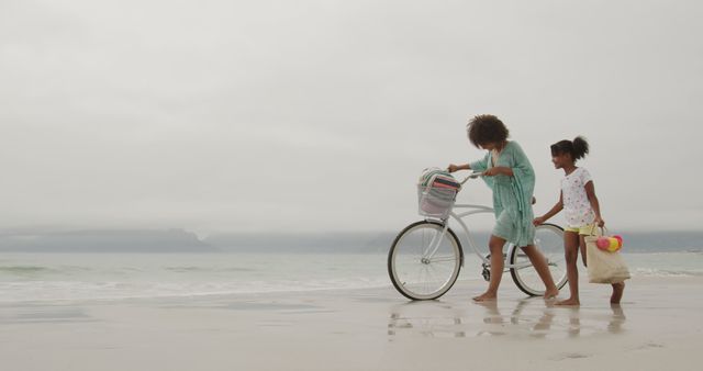 Family Enjoying Day at Beach with Bicycle - Download Free Stock Images Pikwizard.com