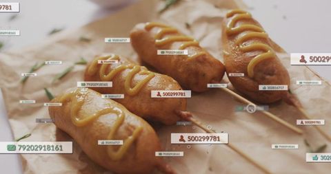 Golden corn dogs on skewers drizzling mustard with floating social media tag overlays