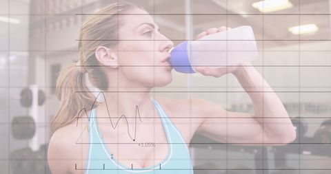 Athletic Woman Staying Hydrated Amidst Digital Data Overlay