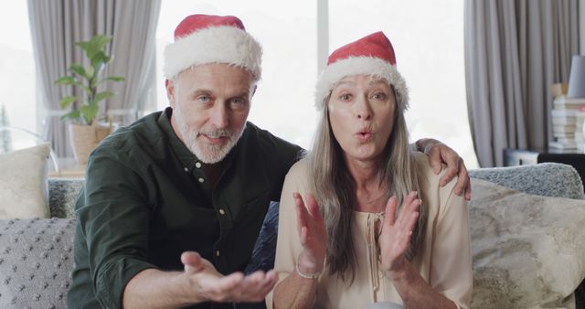 Cheerful Senior Couple Wearing Santa Hats Celebrating Christmas Together - Download Free Stock Images Pikwizard.com