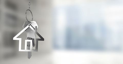 House-Shaped Keychain Symbolizing New Home Ownership and Dreams