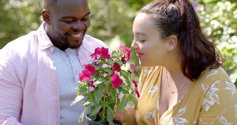 Friends Embracing Nature Together in Lush Garden