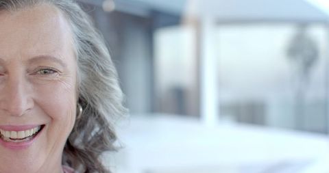 Senior Woman Elegantly Smiling in Modern Interior