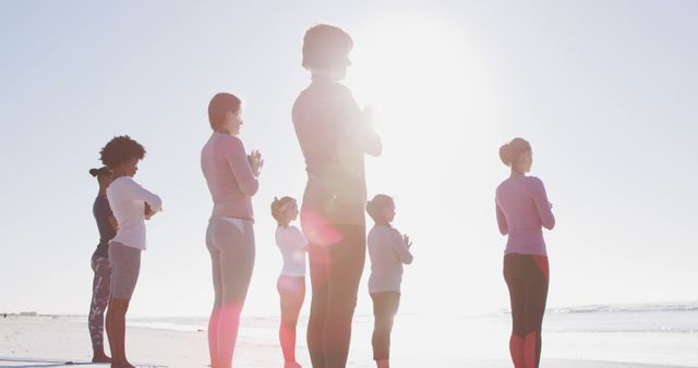 Group Practicing Yoga At Beach During Sunrise - Download Free Stock Images Pikwizard.com