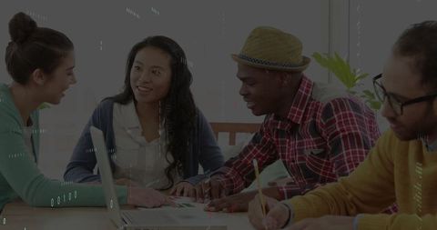 Diverse students collaborating on educational project with technology