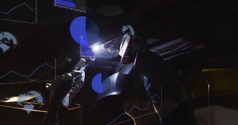 Female Welder Operating Torch Under Welding Helmet With Blue Digital Data Overlays