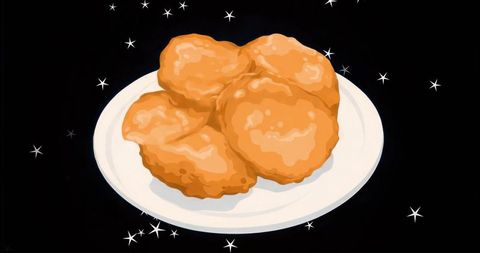 Floating golden chicken nuggets on white plate in starry black background minimal food art