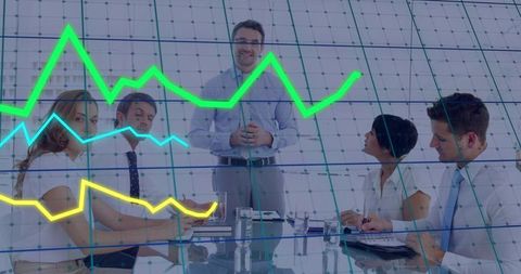 Presenting Executive Leading Team at Glass Table with Financial Line Graphs Overlay
