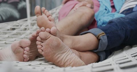 Senior Couple Relaxing in Hammock Enjoying Relaxed Summer Day
