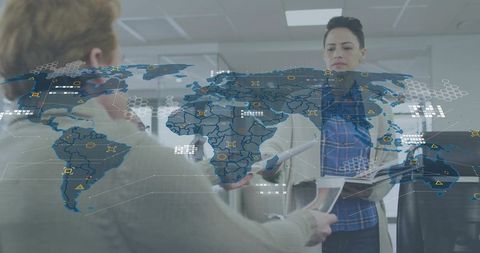 Businesswoman presenting global data overlay while handing documents in modern office