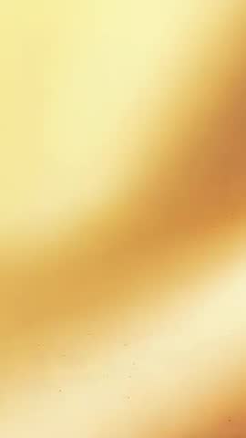 Shifting Golden Gradient Vertical Video with Warm Glow and Subtle Grain