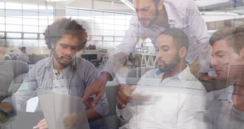 Team meeting in modern workspace completing project together