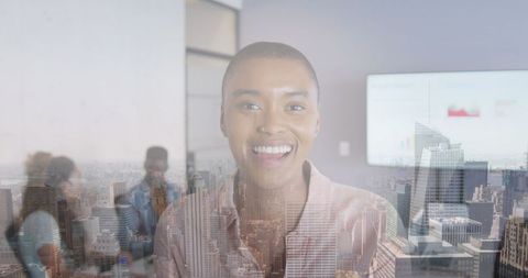 Smiling Businesswoman Presenting in Collaborative Office Environment
