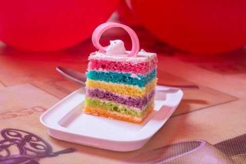 Vibrant Layered Cake with Decorative Swirl Topping