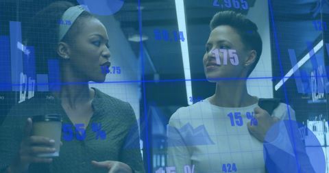 Diverse Female Colleagues Analyzing Data with Digital Interface