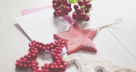 Red Star Ornament with Berries and Pink Card, Rustic Holiday Flat Lay for Greeting Cards