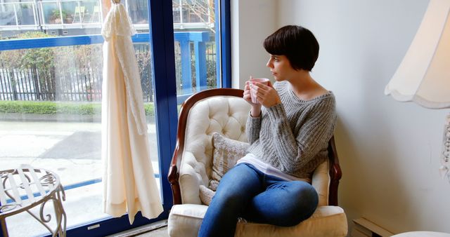 Woman Relaxing Indoors with Coffee Looking Through Window - Download Free Stock Images Pikwizard.com