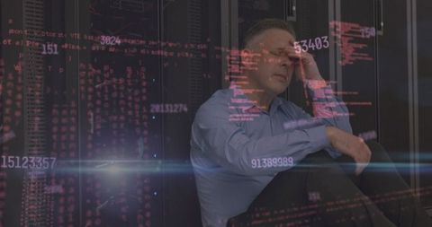 Stressed worker in data center with security code overlay